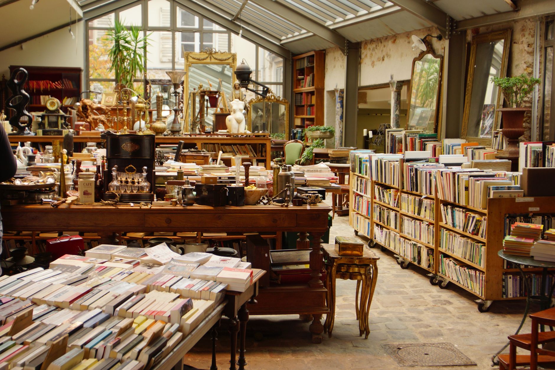 Explore this cozy Parisian vintage bookshop overflowing with books and antiques.